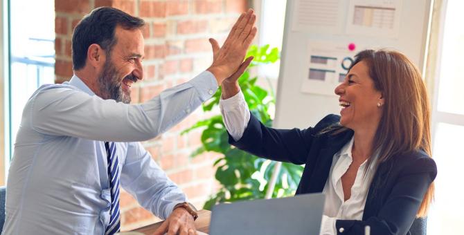 coworkers high-five